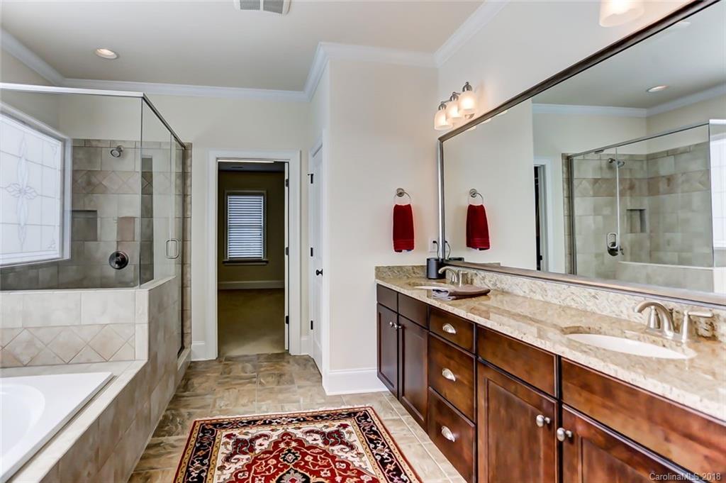 754 Revival Row Fort Mill, SC 29708 - Photo 22 of 35 a bathroom with double vanity sinks double vanity shower and a bathtub
