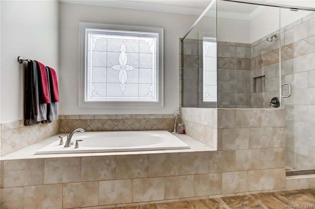 754 Revival Row Fort Mill, SC 29708 - Photo 23 of 35 a bathroom with a tub and a sink