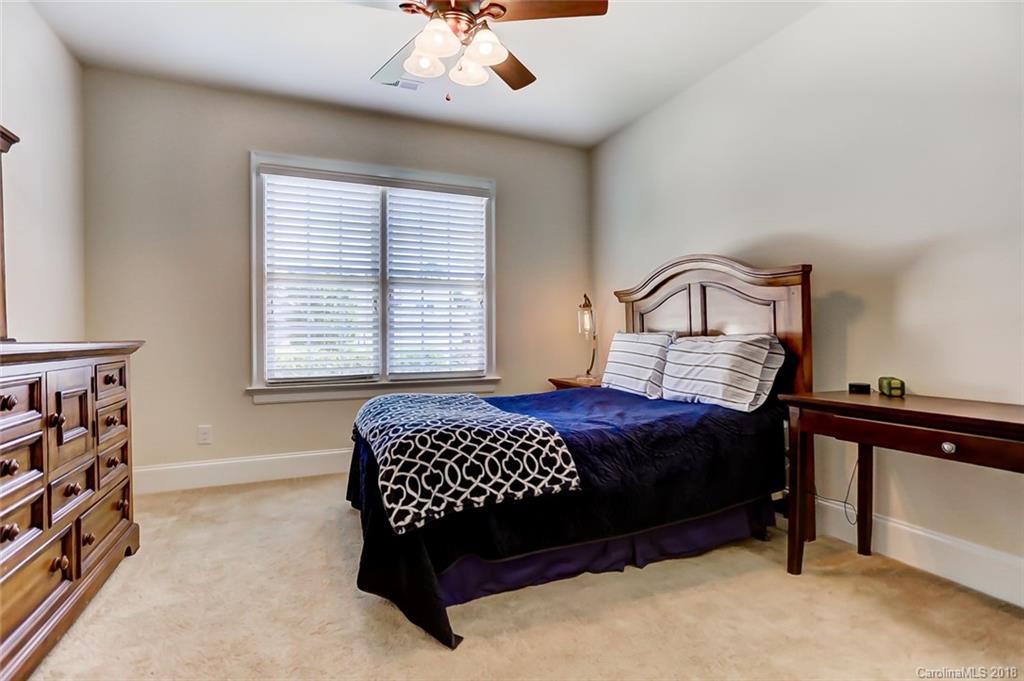 754 Revival Row Fort Mill, SC 29708 - Photo 26 of 35 a bedroom with a bed wooden floor and window