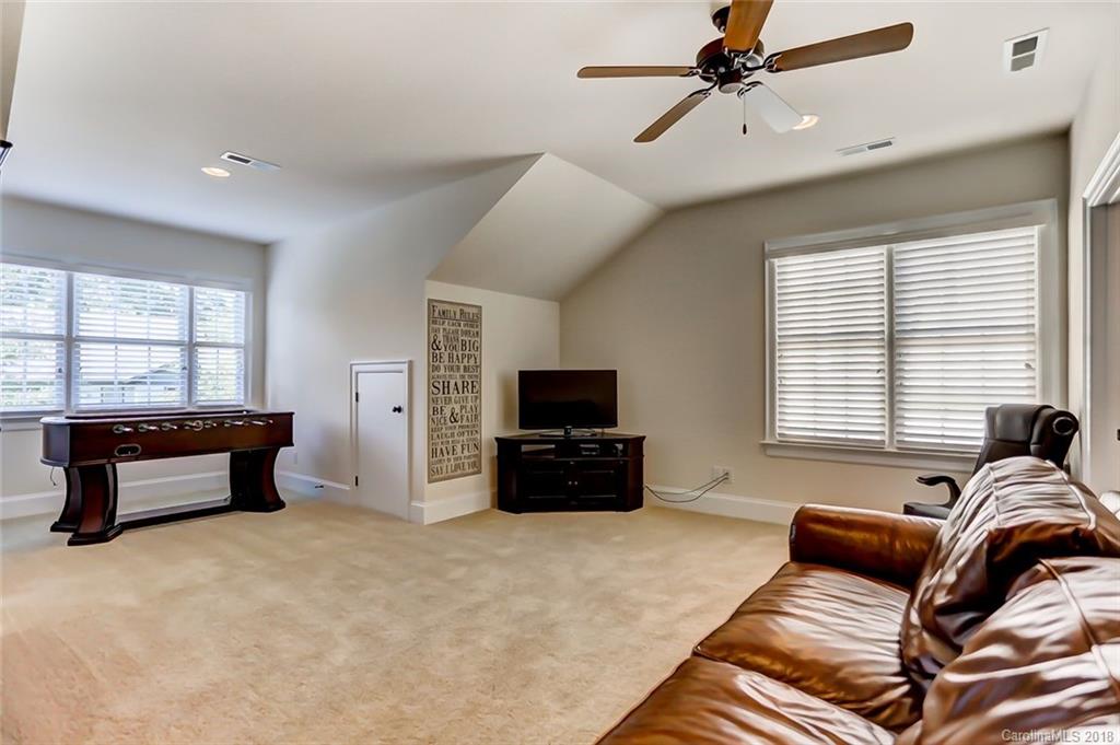 754 Revival Row Fort Mill, SC 29708 - Photo 28 of 35 a living room with furniture and a flat screen tv