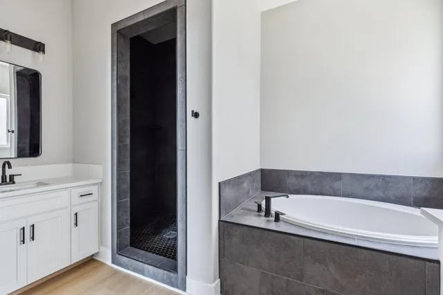 a bathroom with a bathtub and a sink