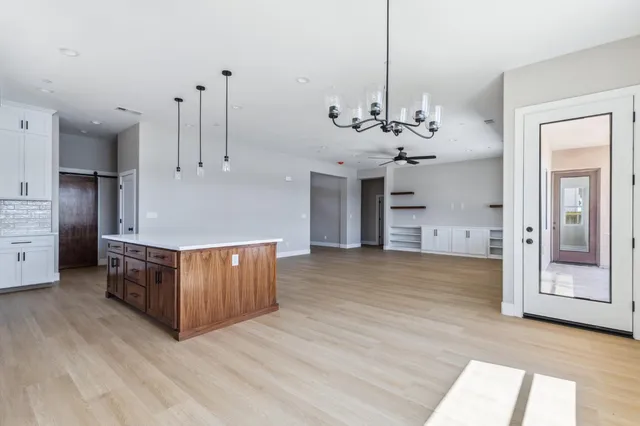 a view of kitchen with sink and cabinets