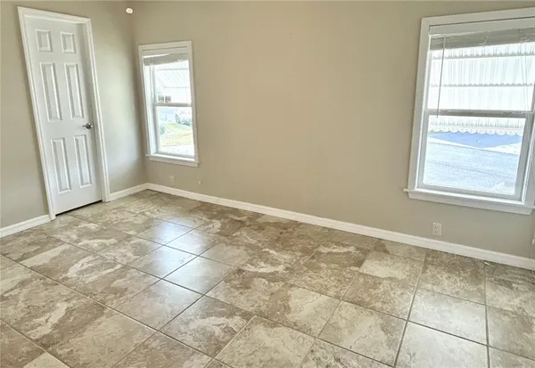 an empty room with windows