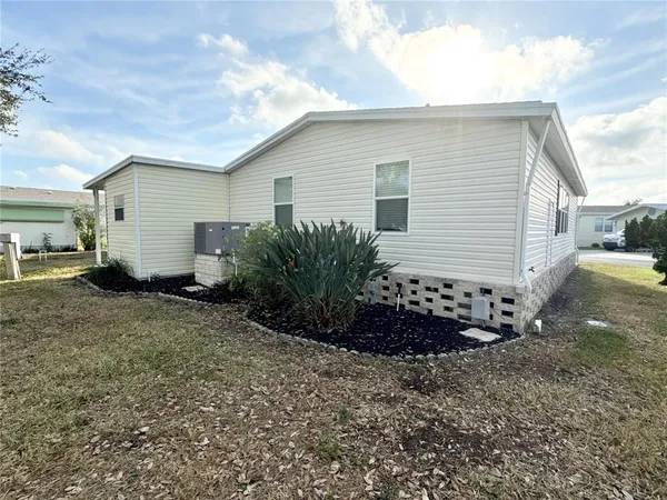 a view of a house with a back yard