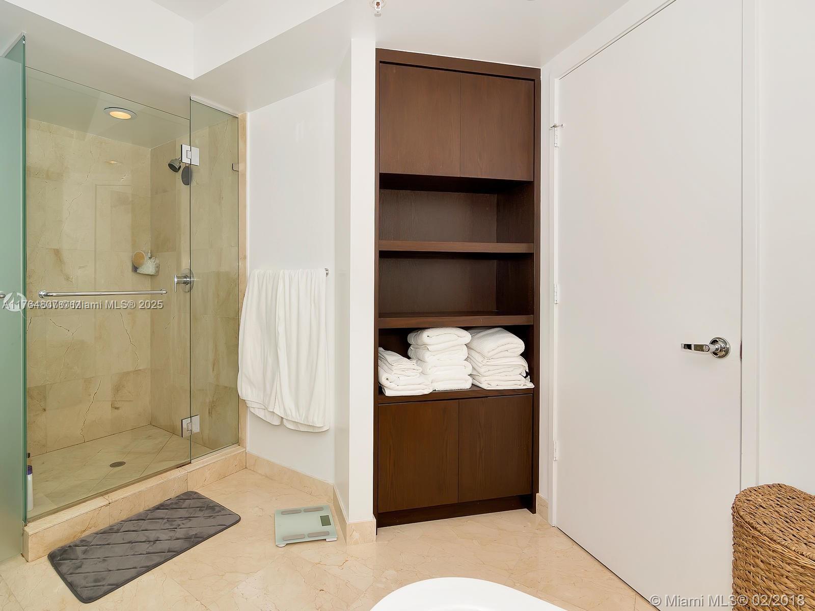 250 Sunny Isles Boulevard, Unit 31403 Sunny Isles Beach, FL 33160 - Photo 12 of 24 a bathroom with a shower