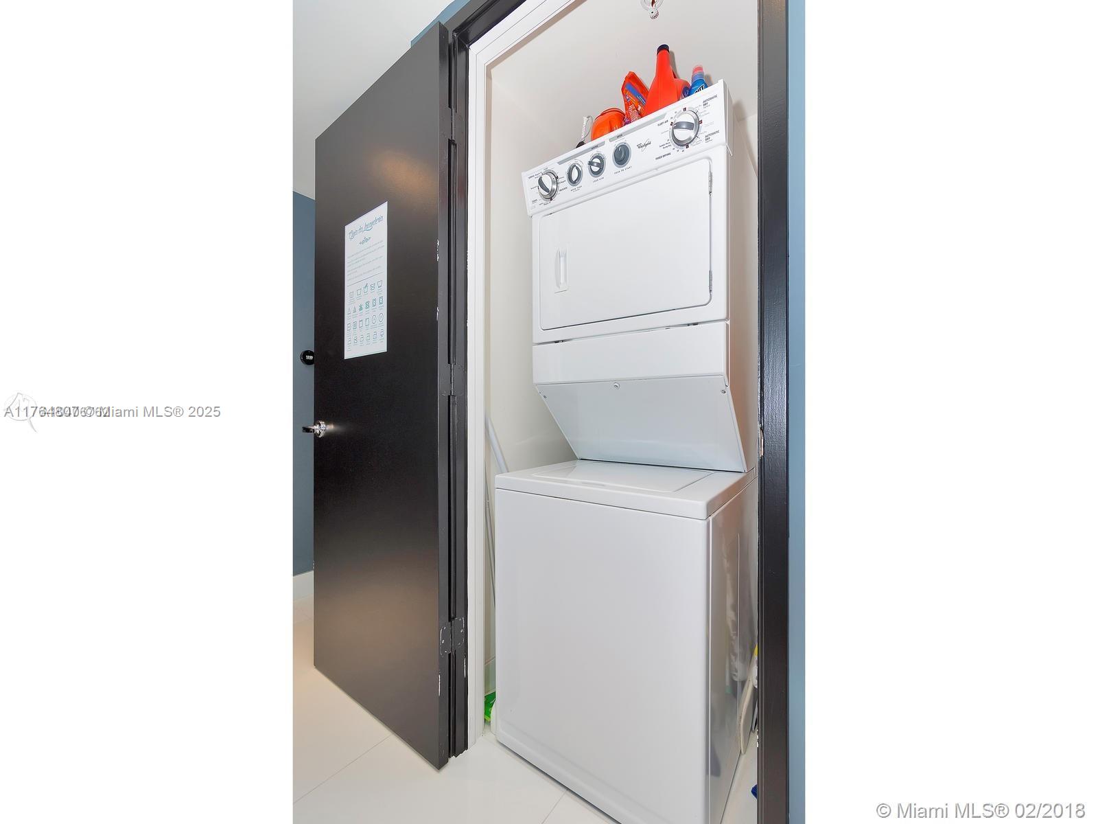 250 Sunny Isles Boulevard, Unit 31403 Sunny Isles Beach, FL 33160 - Photo 22 of 24 a utility room with dryer and washer