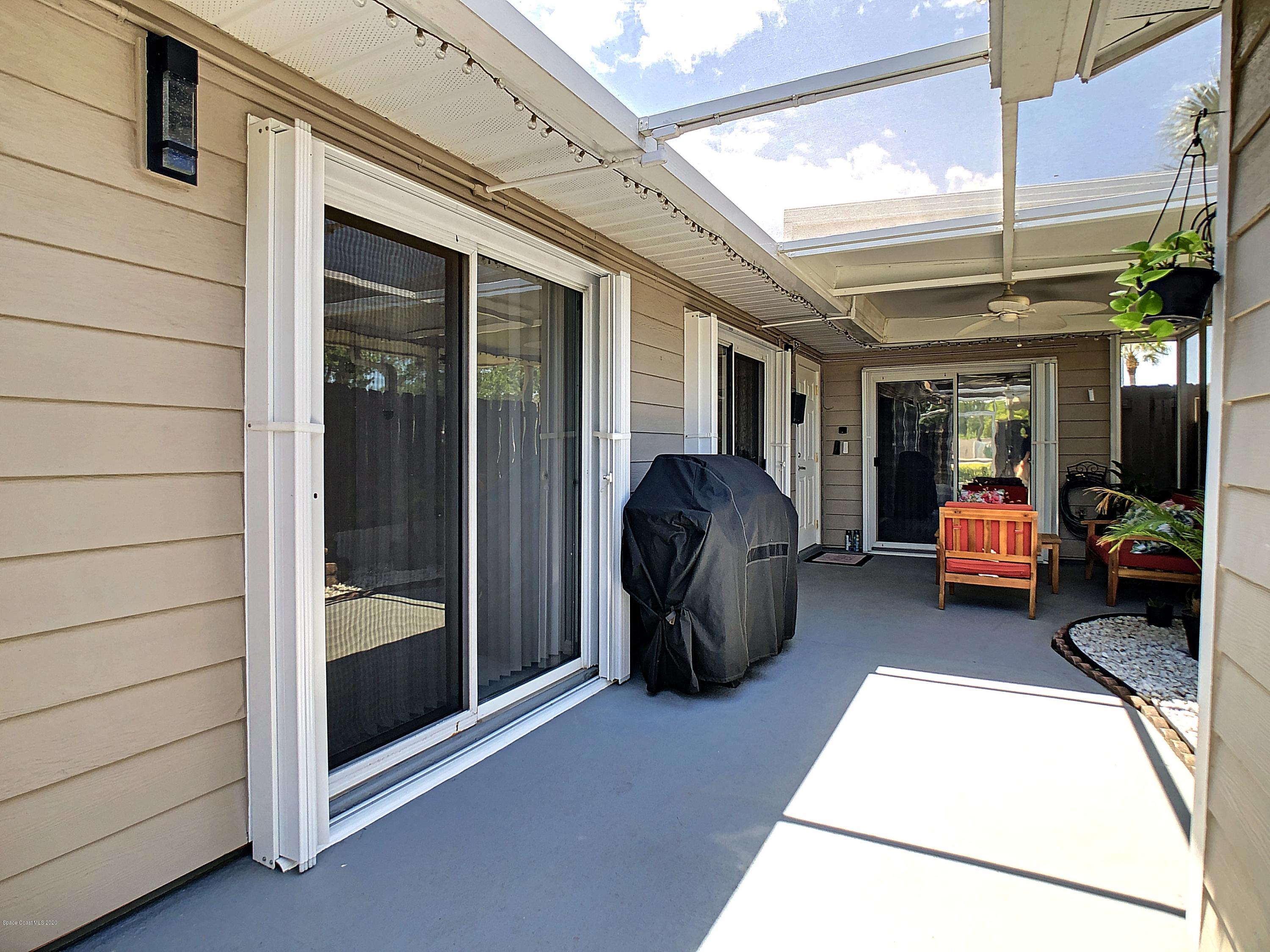 1946 Quail Ridge Court, Unit 802 Cocoa, FL 32926 - Photo 2 of 19 Screened Front Porch