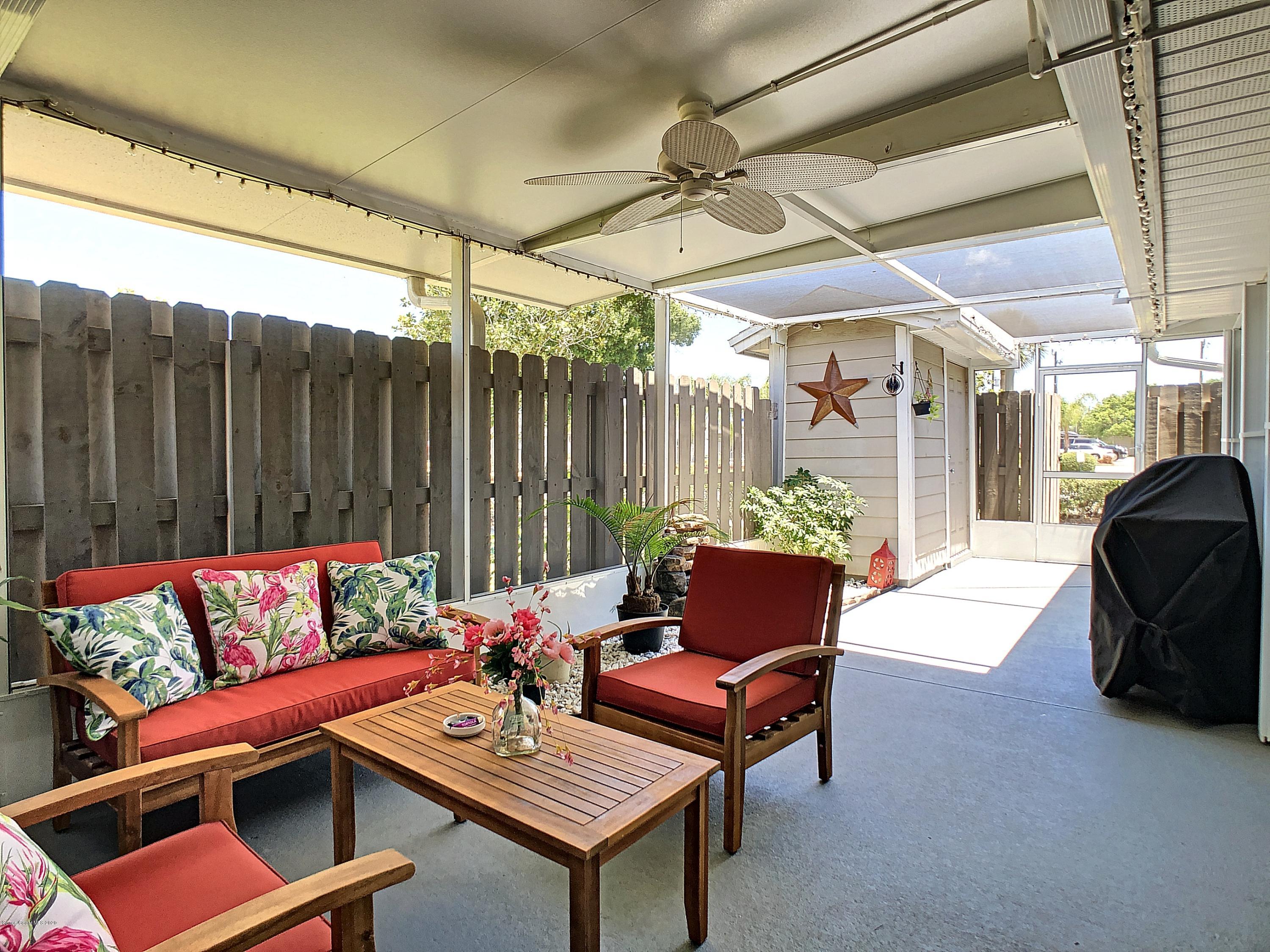 1946 Quail Ridge Court, Unit 802 Cocoa, FL 32926 - Photo 4 of 19 Screened Front Porch