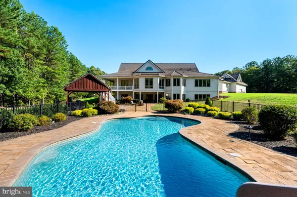 a view of a house with swimming pool
