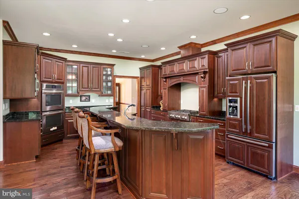a spacious bedroom with a bed and a chandelier