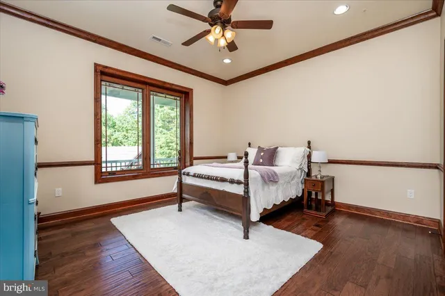 a spacious bathroom with a granite countertop sink and a mirror