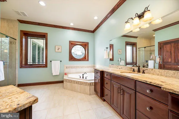 a view of a kitchen counter space and wooden floor