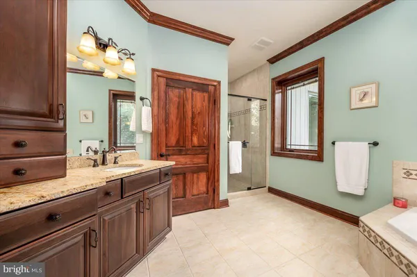 a kitchen with stainless steel appliances granite countertop a stove and a refrigerator