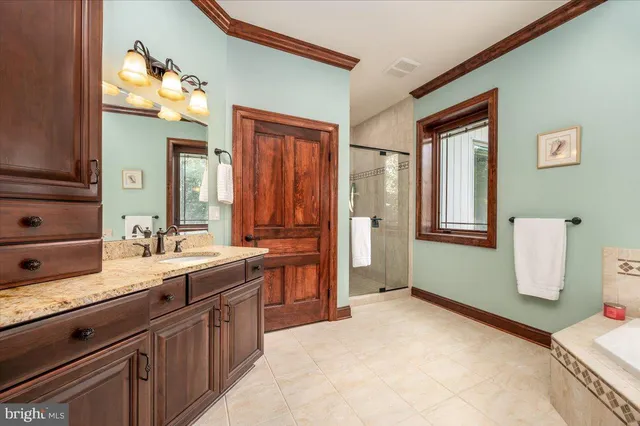 a kitchen with stainless steel appliances granite countertop a stove and a refrigerator