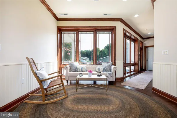 a kitchen with sink cabinets and wooden floor