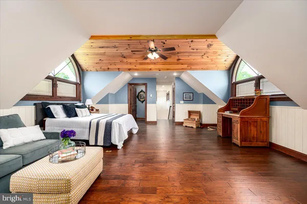 a living room with a fireplace a large window and a fireplace