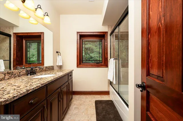 an aerial view of a house with a swimming pool