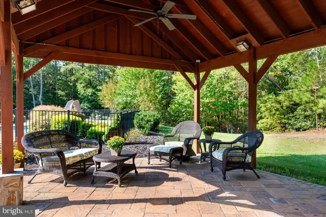 an aerial view of residential house with outdoor space and swimming pool