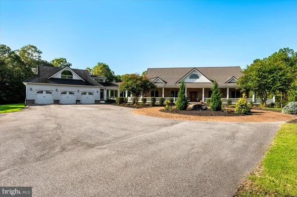 a living room with fireplace furniture and a flat screen tv
