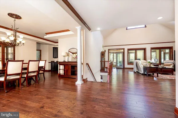 a very nice looking living room with wooden floor and furniture
