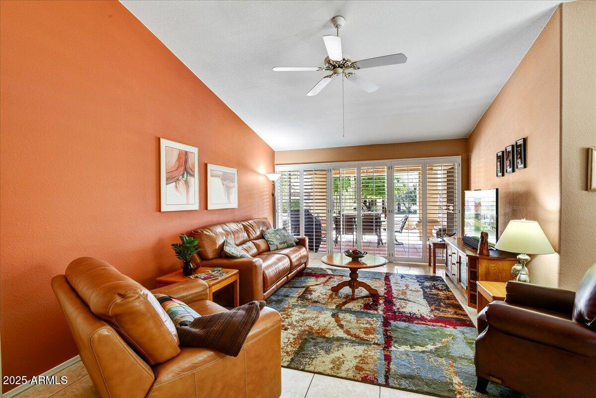 9013 West Marco Polo Road Peoria, AZ 85382 - Photo 11 of 30 a living room with furniture and a large window