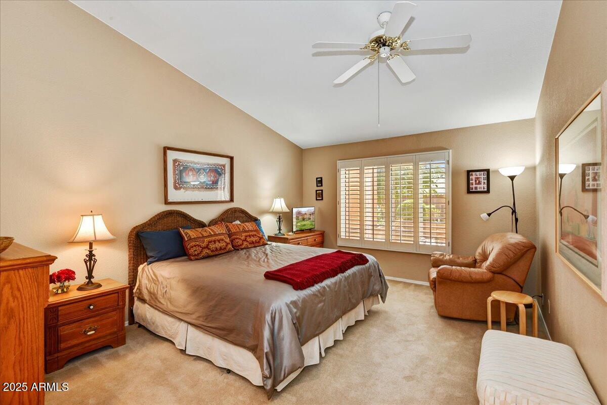 9013 West Marco Polo Road Peoria, AZ 85382 - Photo 12 of 30 a bedroom with a bed and furniture