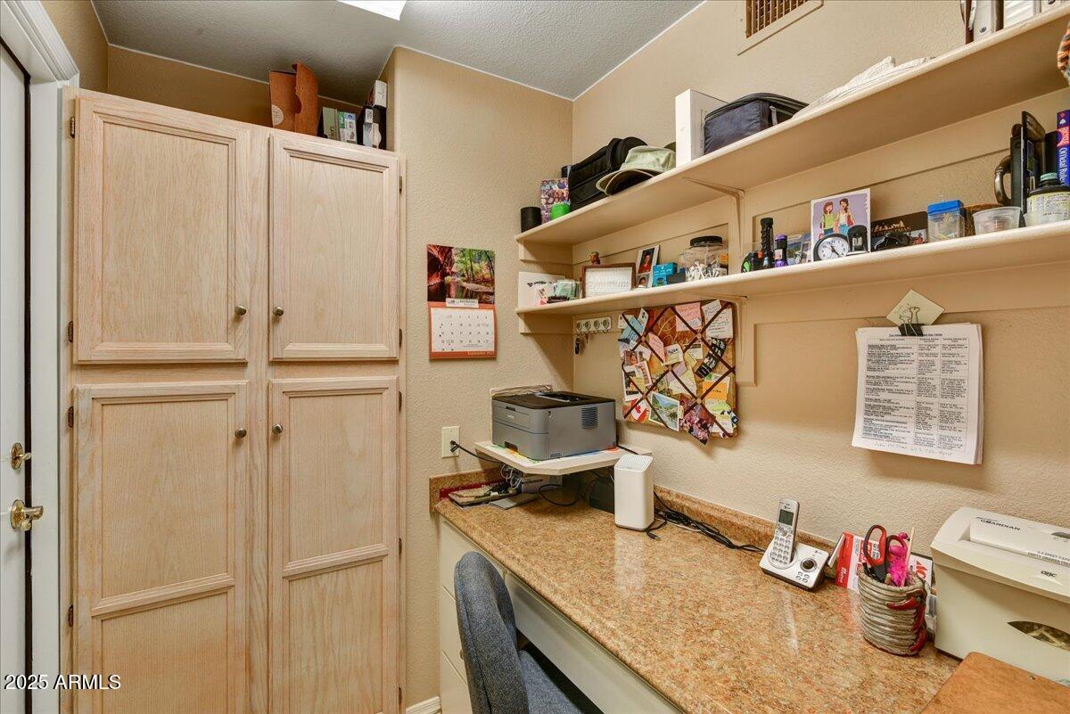 9013 West Marco Polo Road Peoria, AZ 85382 - Photo 16 of 30 a kitchen with a refrigerator and white cabinets