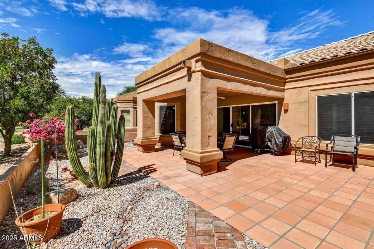 9013 West Marco Polo Road Peoria, AZ 85382 - Photo 2 of 30 a view of a house with backyard porch and sitting area