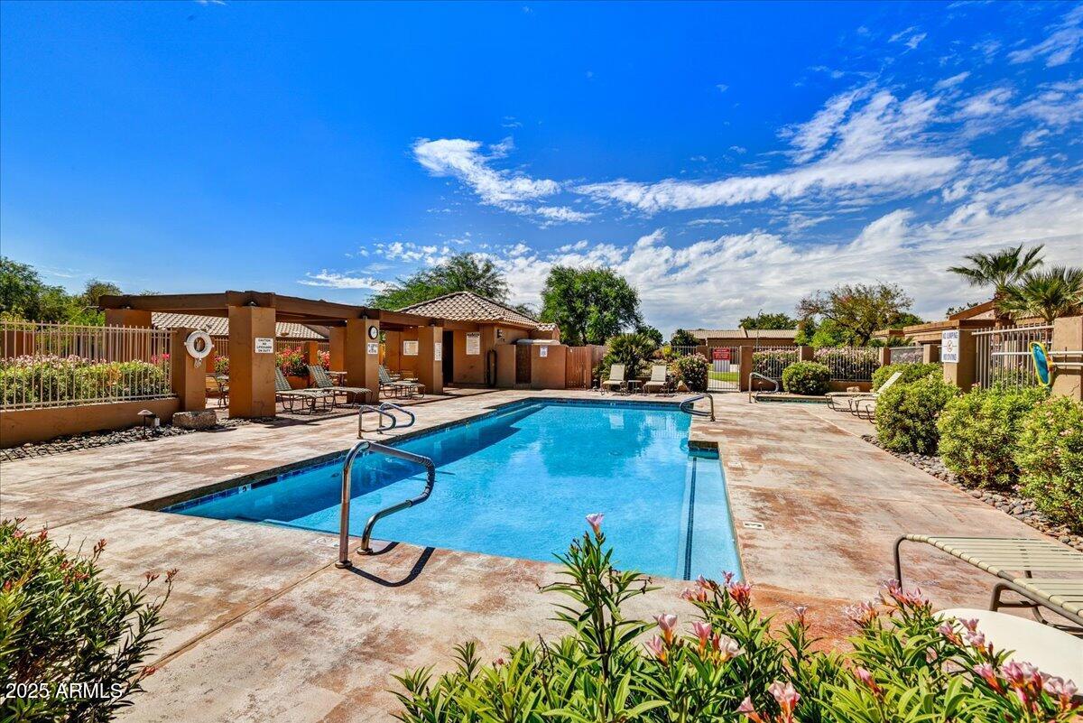 9013 West Marco Polo Road Peoria, AZ 85382 - Photo 21 of 30 a swimming pool with outdoor seating and yard