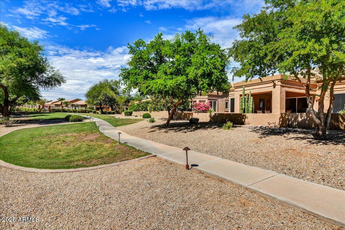 9013 West Marco Polo Road Peoria, AZ 85382 - Photo 22 of 30 a view of a house with a yard