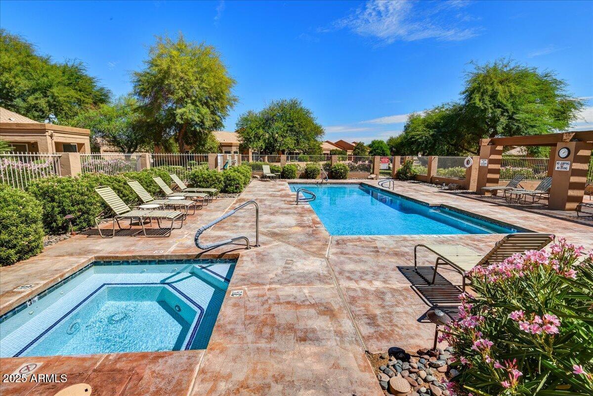 9013 West Marco Polo Road Peoria, AZ 85382 - Photo 23 of 30 a view of a swimming pool with a lounge chairs
