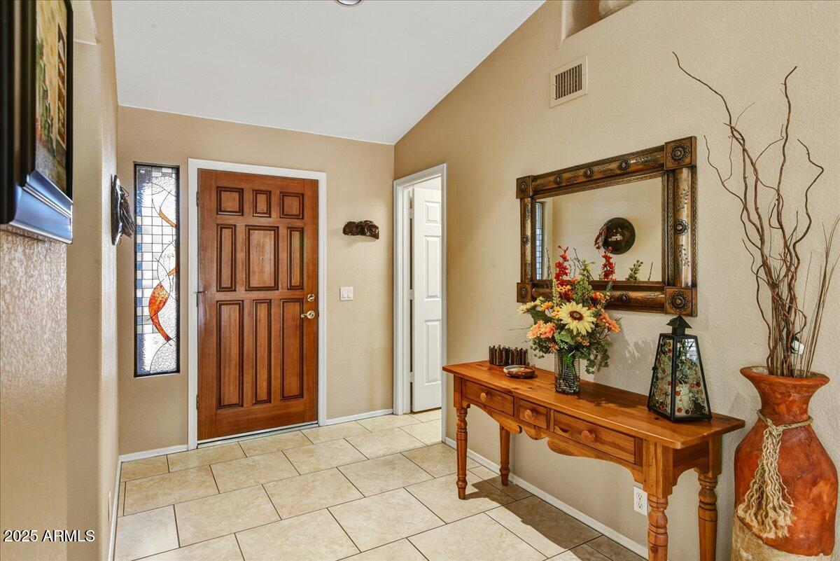 9013 West Marco Polo Road Peoria, AZ 85382 - Photo 5 of 30 a view of an entryway with wooden floor