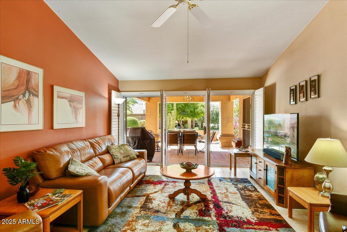 9013 West Marco Polo Road Peoria, AZ 85382 - Photo 6 of 30 a living room with furniture and a large window