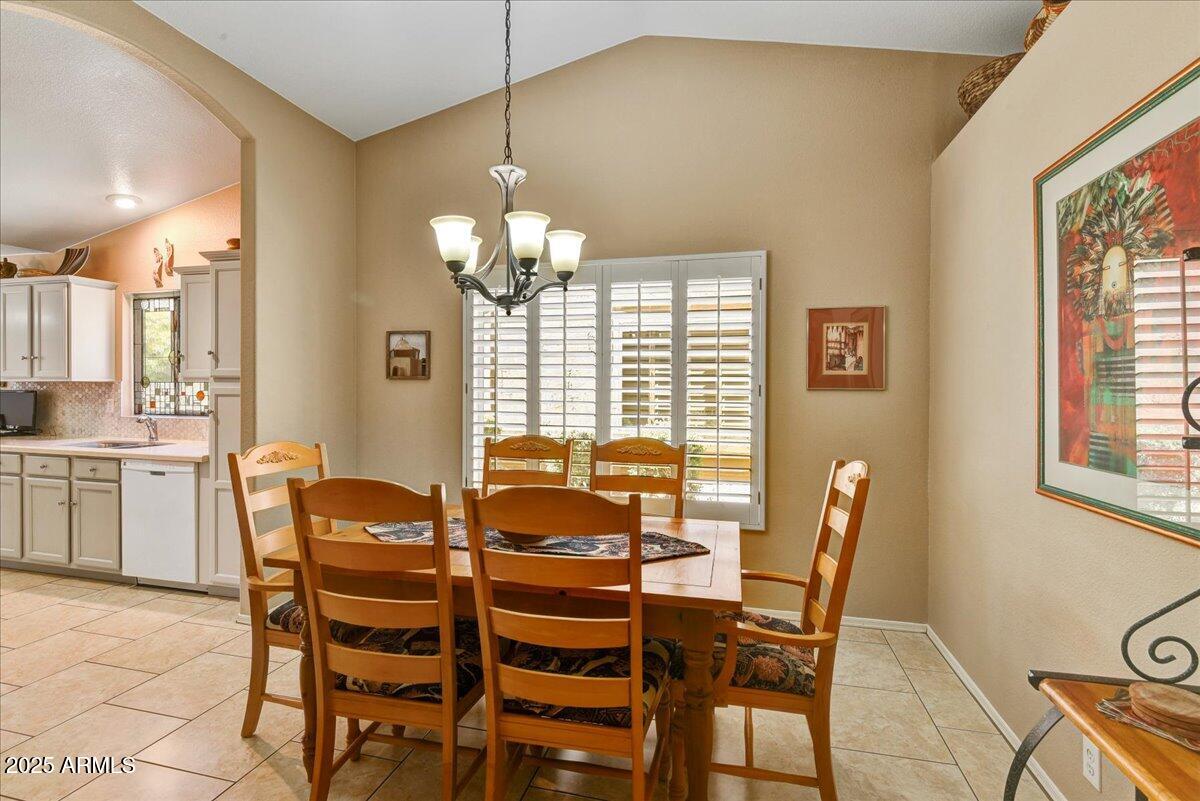 9013 West Marco Polo Road Peoria, AZ 85382 - Photo 7 of 30 a view of a dining room with furniture and chandelier