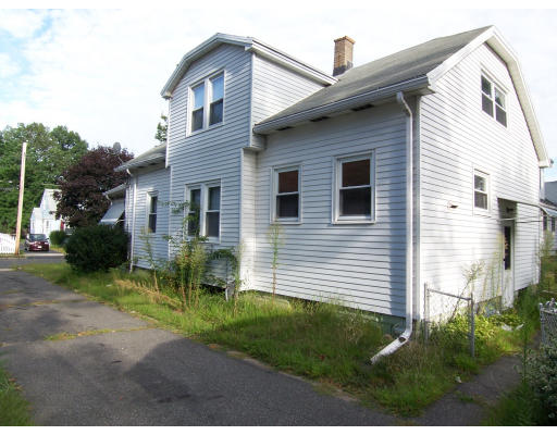 59 Redlands Street Springfield, MA 01104 - Photo 3 of 3 a front view of a house with a yard