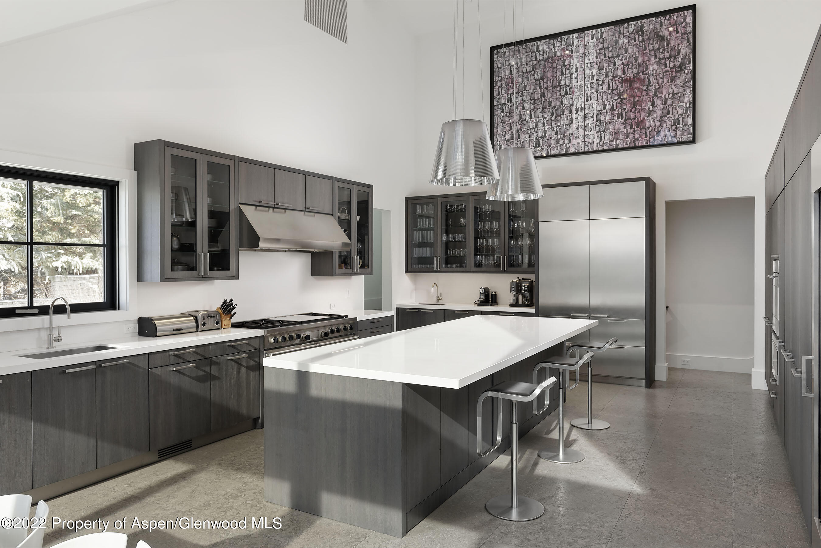 257 Ridge Road Aspen, CO 81612 - Photo 12 of 47 a kitchen with a sink a counter top space and stainless steel appliances
