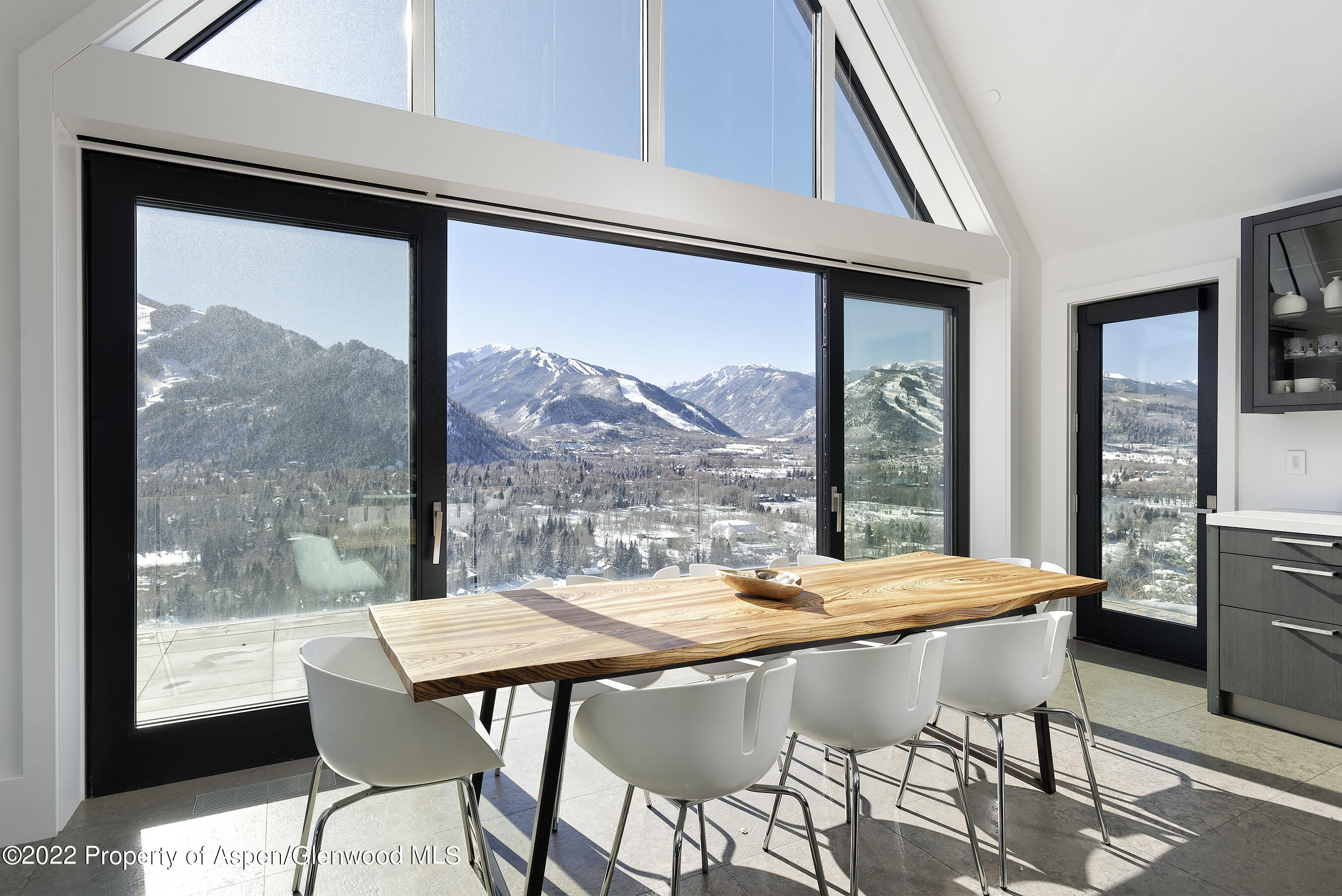 257 Ridge Road Aspen, CO 81612 - Photo 14 of 47 a view of a dining room with furniture large window and outside view