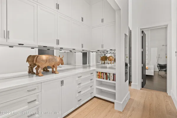 a kitchen with cabinets and window