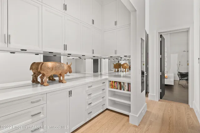 a kitchen with cabinets and window