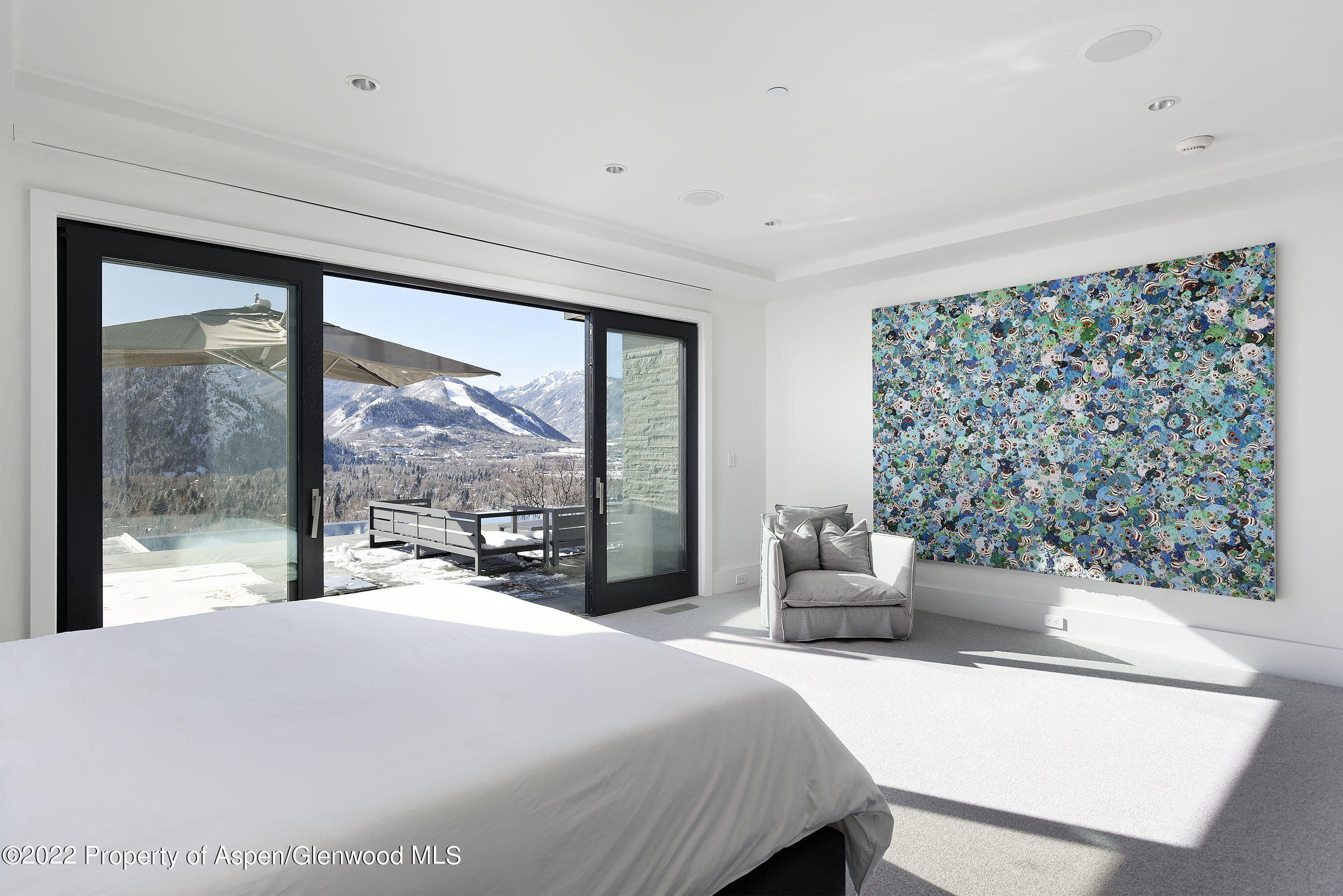 257 Ridge Road Aspen, CO 81612 - Photo 21 of 47 a bedroom with a large bed and a large window