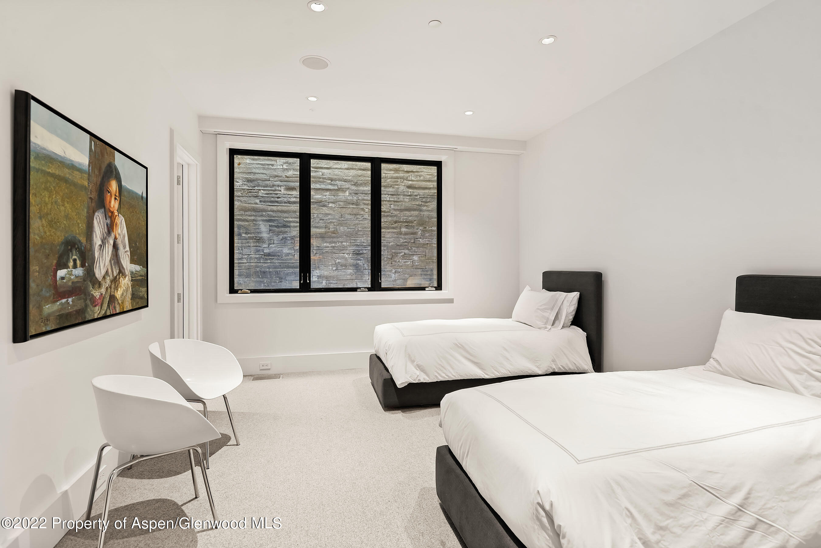 257 Ridge Road Aspen, CO 81612 - Photo 27 of 47 a bedroom with two beds and a large window