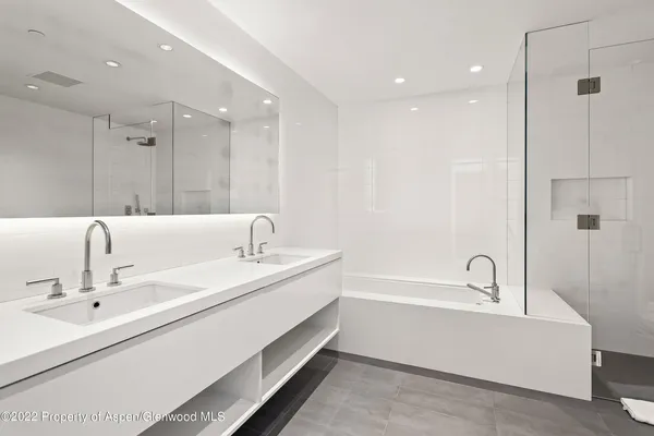 a bathroom with a bathtub and a sink