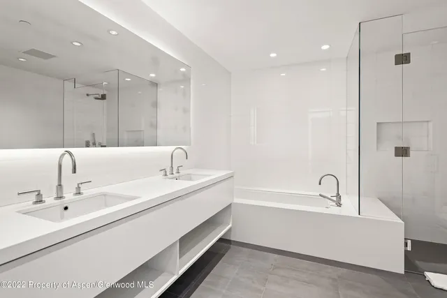 a bathroom with a bathtub and a sink