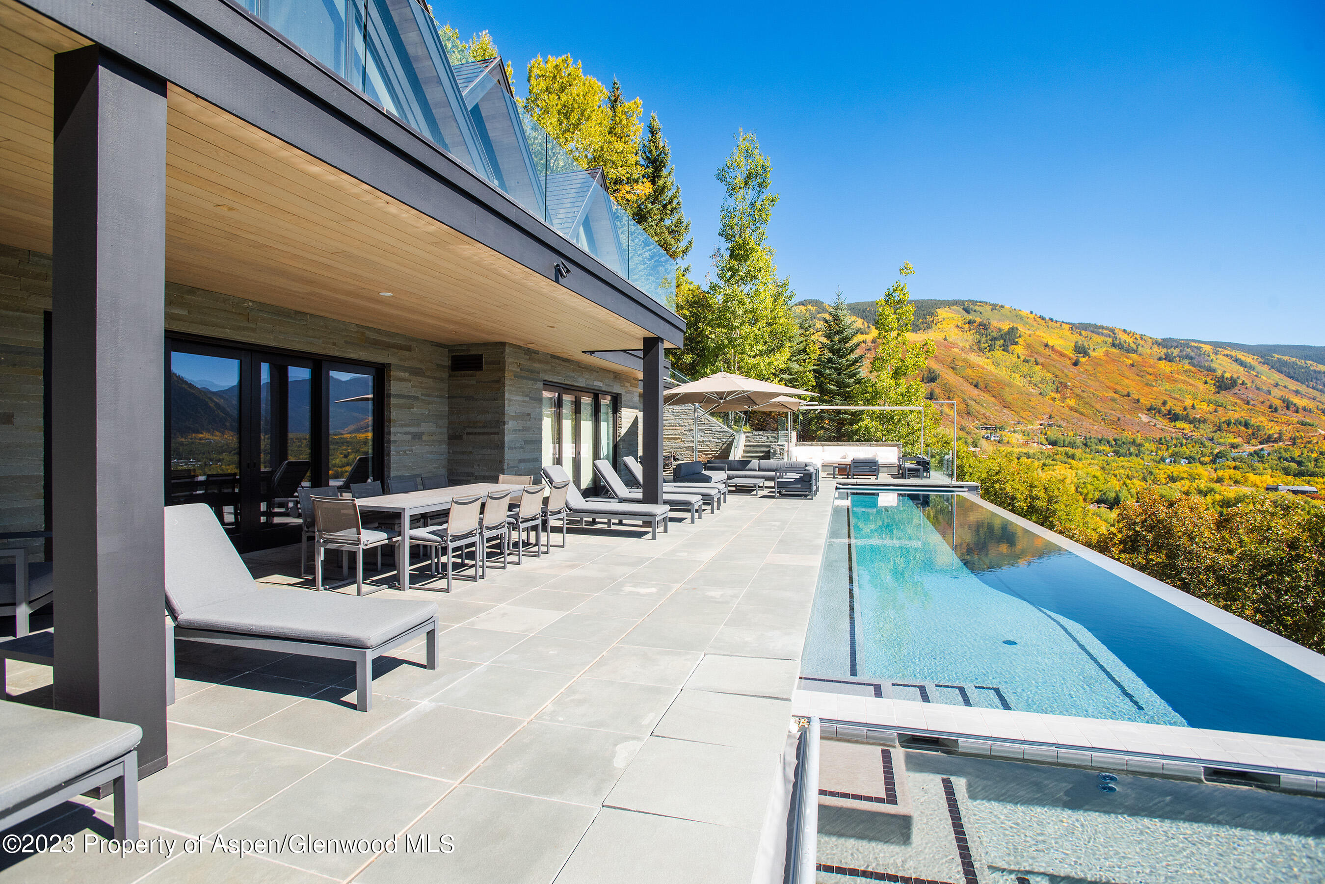 257 Ridge Road Aspen, CO 81612 - Photo 40 of 47 a view of a patio with couches table and chairs
