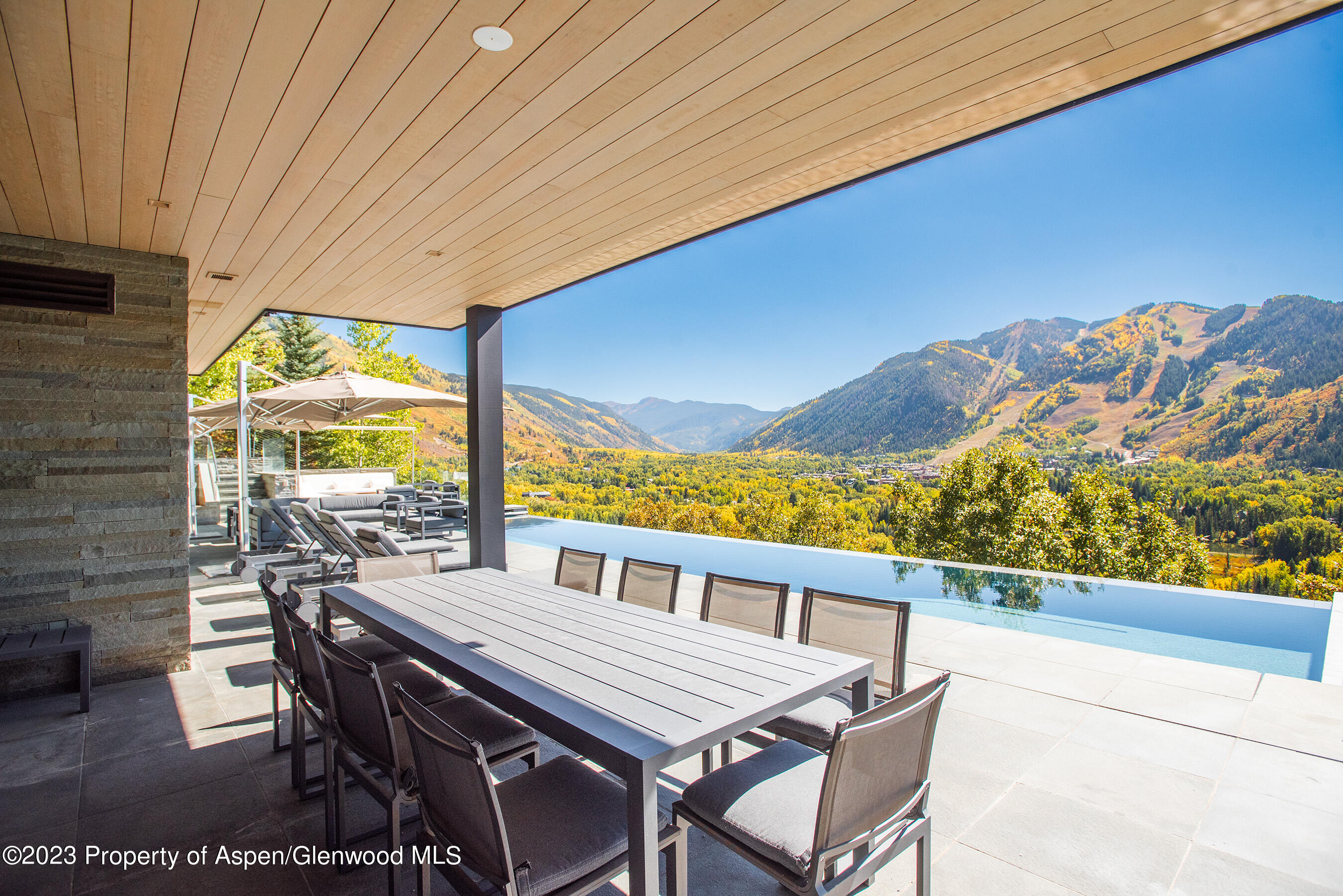 257 Ridge Road Aspen, CO 81612 - Photo 43 of 47 a view of a patio with a table and chairs