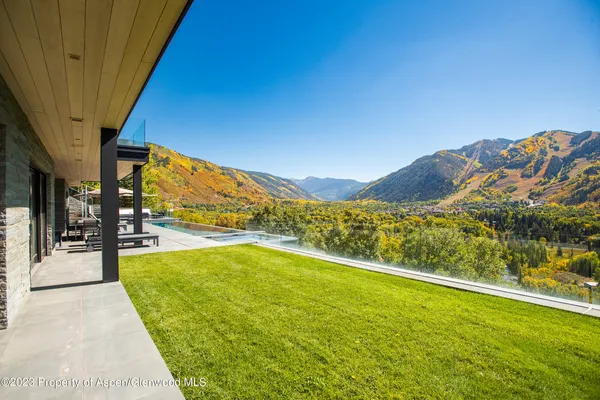 a view of an ocean with a mountain