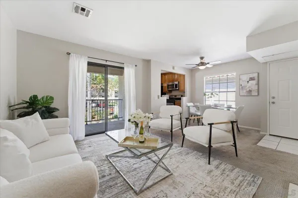 a living room with furniture and a window