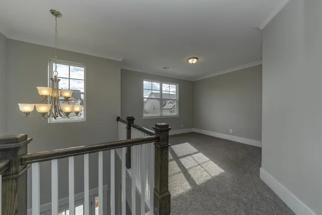a view of entryway and hall with a window