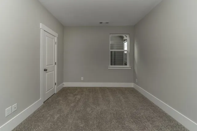 wooden floor and window in an empty room