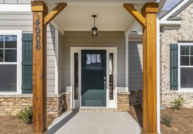 a front view of a house with large windows